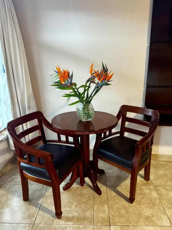 Handcrafted wooden furniture and fresh flowers
